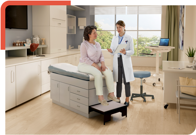 Doctor with clipboard speaking to a patient